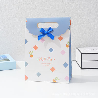 Elegant Bow Handle Paper Gift Bags With Velcro Closure Minimalist Flap Style Packaging For Festive Gifts And Events