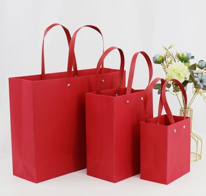 Luxury Red Rivet Handle Paper Bags Custom Logo Boutique Shopping Bags For Fashion Gifts