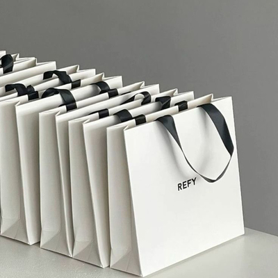 Custom Logo Kraft Gift Bags with Ribbon Handles for Boutiques
